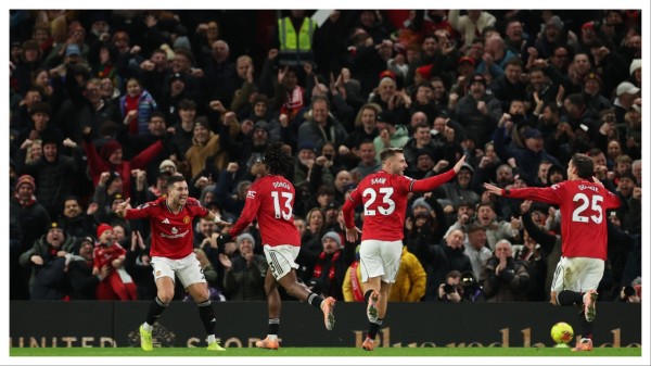 Manchester United players celebrate their goal against Newcastle United on Friday.