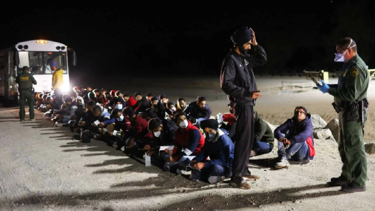 Immigrants from India wait to board a U.S. Border Patrol bus to be taken for processing after crossing the border from Mexico on May 22, 2022 in Yuma, Arizona. (Mario Tama/Getty Images)
Representational Image