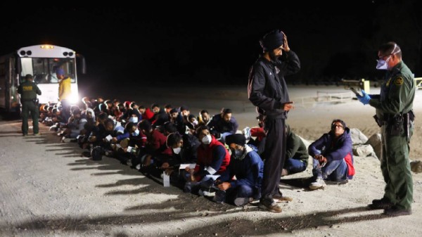 Immigrants from India wait to board a U.S. Border Patrol bus to be taken for processing after crossing the border from Mexico on May 22, 2022 in Yuma, Arizona. (Mario Tama/Getty Images)
Representational Image