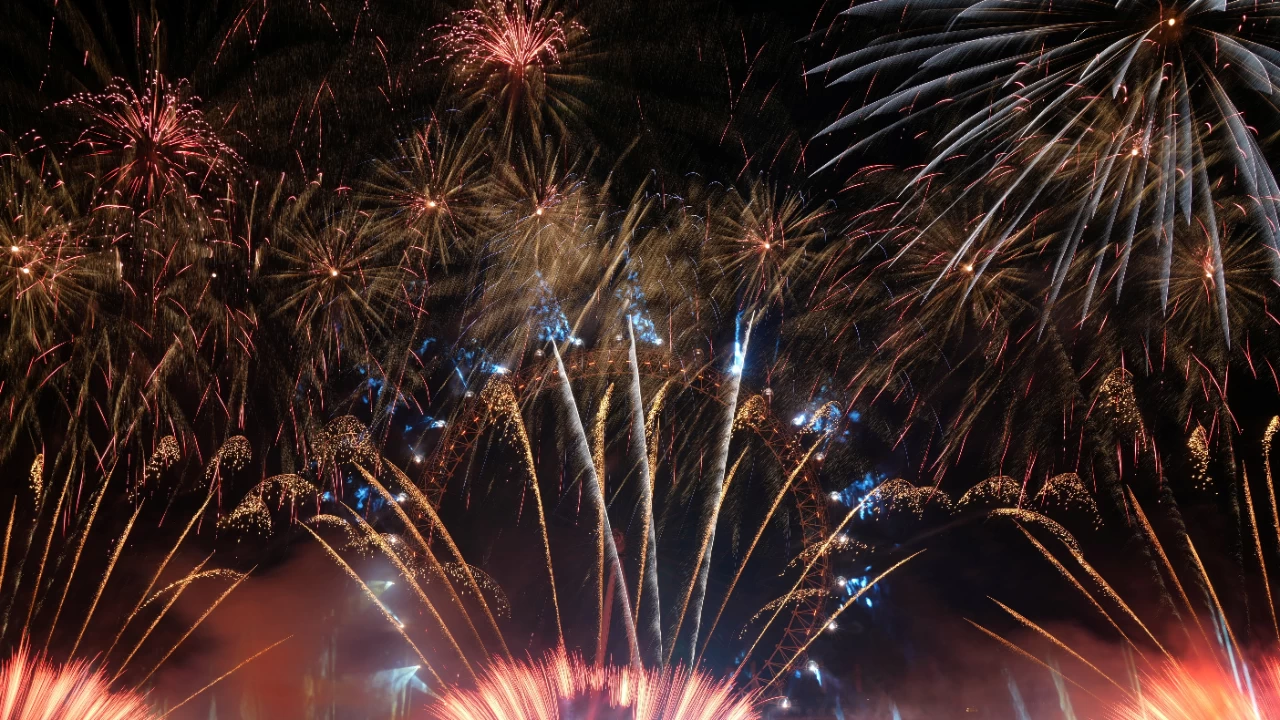 Fireworks explode over the London Eye Ferris wheel to mark the New Year's celebrations. (Photo credit: Reuters)