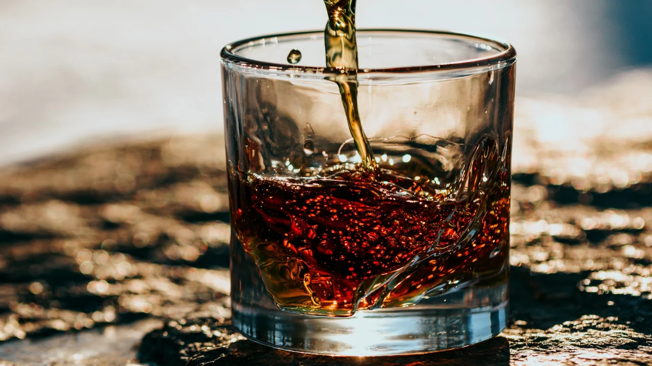 The families of those who have died from alcohol consumption are demanding the removal of the liquor shops. (Photo credit: Unsplash)