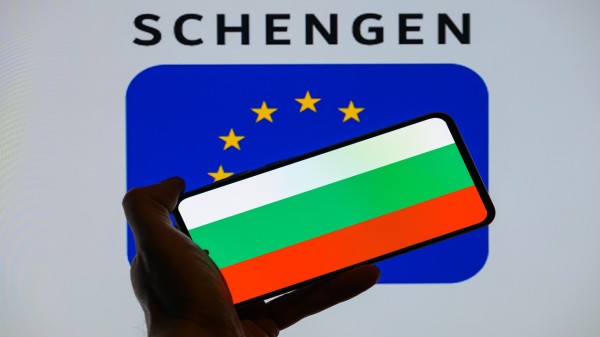 The Bulgaria flag is displayed on a mobile device with the European Union Schengen flag in this photo illustration. (Photo by Jonathan Raa/NurPhoto via Getty Images)