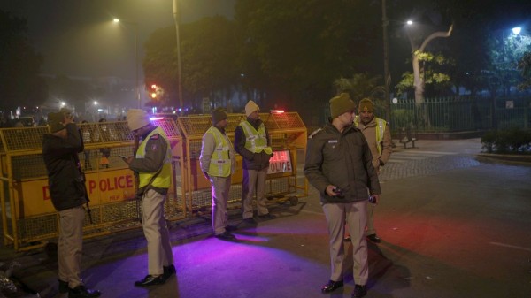Police and security personnel stand guard on New Years on a cold winter evening, at Connaught Place, in New Delhi, Wednesday, December 31, 2025