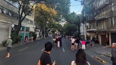 People wait on the street after evacuating following an earthquake in Mexico City, Mexico on January 2