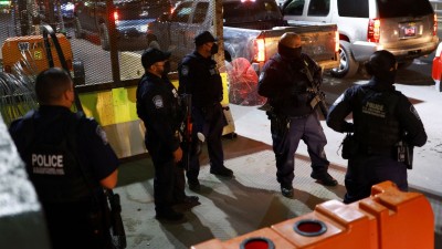 US Customs and Border Protection agents stand guard at the Paso del Norte International Bridge, ​​after the US struck Venezuela and captured its President Nicolas Maduro and his wife Cilia Flores, as seen from Ciudad Juarez, Mexico