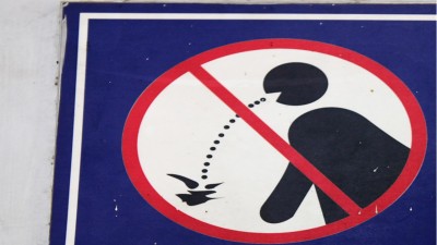 The city is cracking down on spitting with fines and public shaming. (Getty Images)