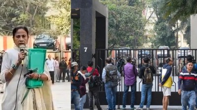 Mamata Banerjee with the green file which she took away from Pratik Jain's resident (right) during an ED raid last week 