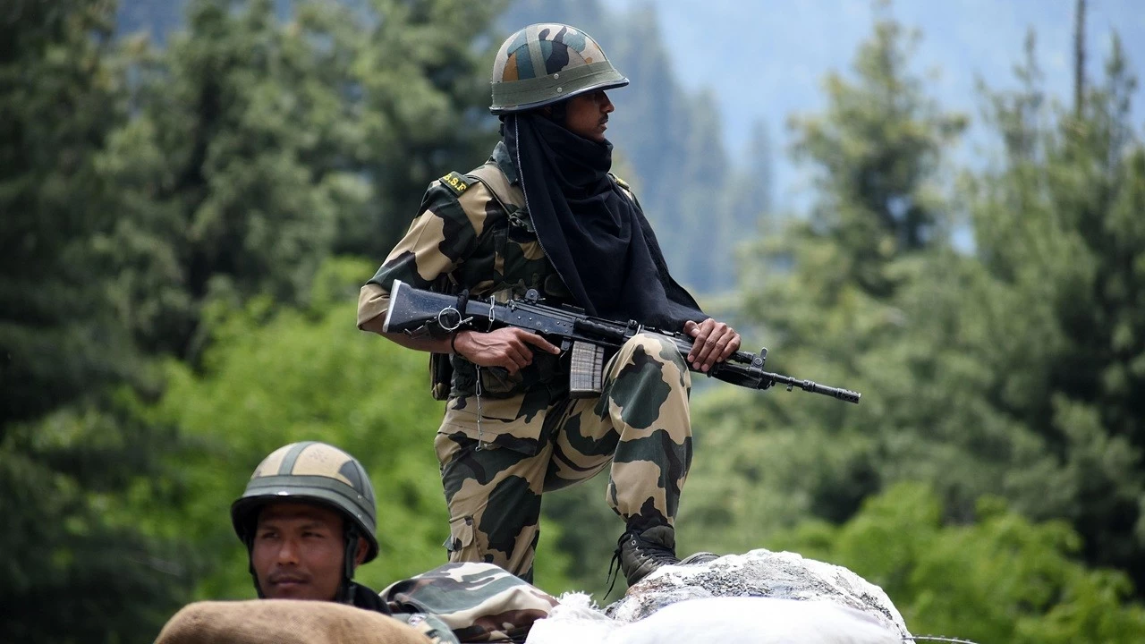 An Indian border security force soldier keeping vigil from a bunker along the Srinagar-Leh National highway on June 17, 2020.