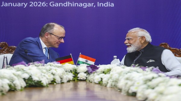 Prime Minister Narendra Modi and German Chancellor Friedrich Merz during the India-Germany CEOs Forum at Mahatma Mandir Convention Centre, in Gandhinagar, Gujarat. (PMO via PTI Photo)