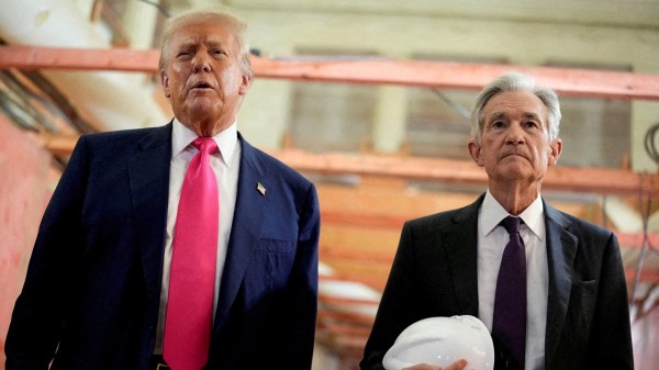 US President Donald Trump and Federal Reserve Chair Jerome Powell speak during a tour of the Federal Reserve Board building.
