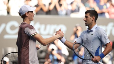 FILE - Jannik Sinner of Italy shakes hands with Novak Djokovic of Serbia in their semifinal during the 2024 Australian Open in Melbourne, Australia.