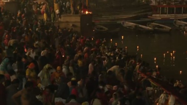 Devotees take a holy dip in the Ganga river in Varanasi on the occasion of Makar Sankranti