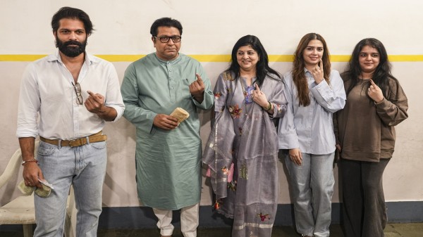 MNS chief Raj Thackeray with party leader and his son Amit Thackeray and other family members, shows his ink-marked finger after casting a vote in the BMC polls, in Mumbai, Thursday, on January 15, 2026. (PTI Photo/Kunal Patil)

