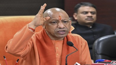 Uttar Pradesh Chief Minister Yogi Adityanath speaks during a review meeting on ongoing development works and law-and-order situation in Varanasi on Saturday. 