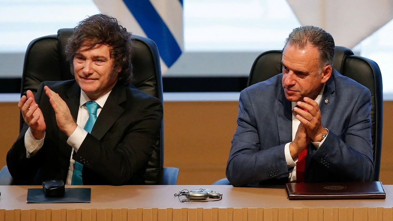 Argentina's President Javier Milei and Uruguay's President Yamandu Orsi applaud during the signing ceremony of a free trade agreement between the European Union and the South American bloc Mercosur.