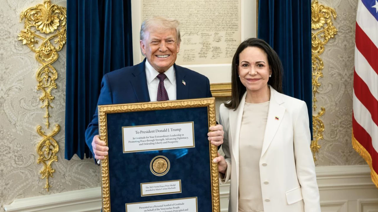 Trump posing with the Noble Peace Prize presented to him by Machado. (Photo credit: X)