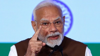 PM Modi greeted the vast crowd that gathered at Singur to see him, much to the cheer and delight of the people. (Photo credit: Reuters)