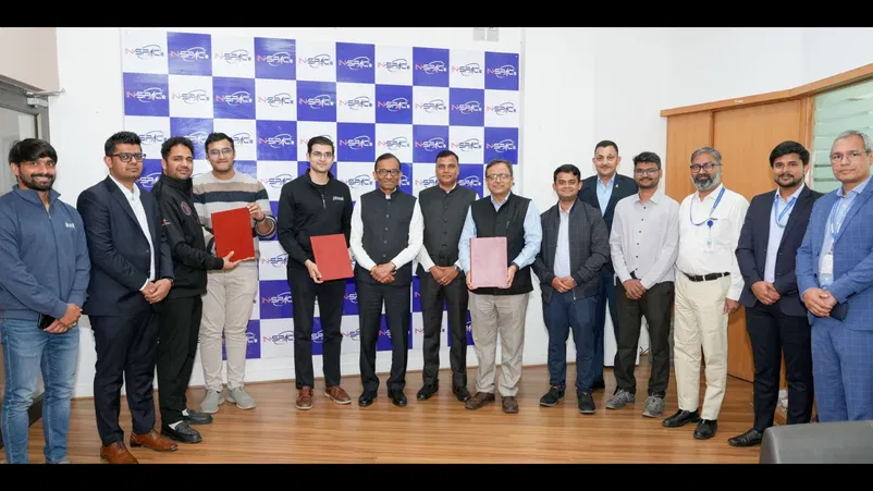 Officials from In-Space and the startups with the agreement. 