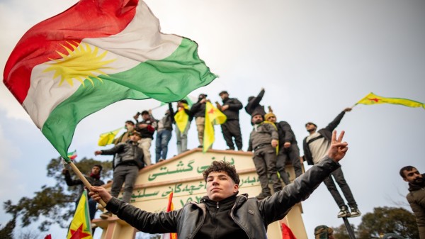 People march during a protest in support of the Kurdish people on January 20, 2026 in Sulaymaniyah, Iraq.