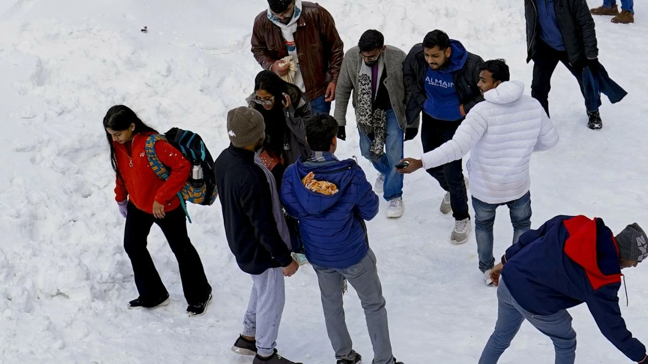 Stranded tourists clicked photographs, enjoying the chilly weather amid a break from the city’s cacophony