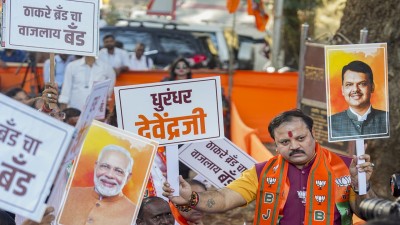 BJP workers hold placards during celebrations of their party's victory in the BMC elections in Mumbai. Representational Image (PTI)